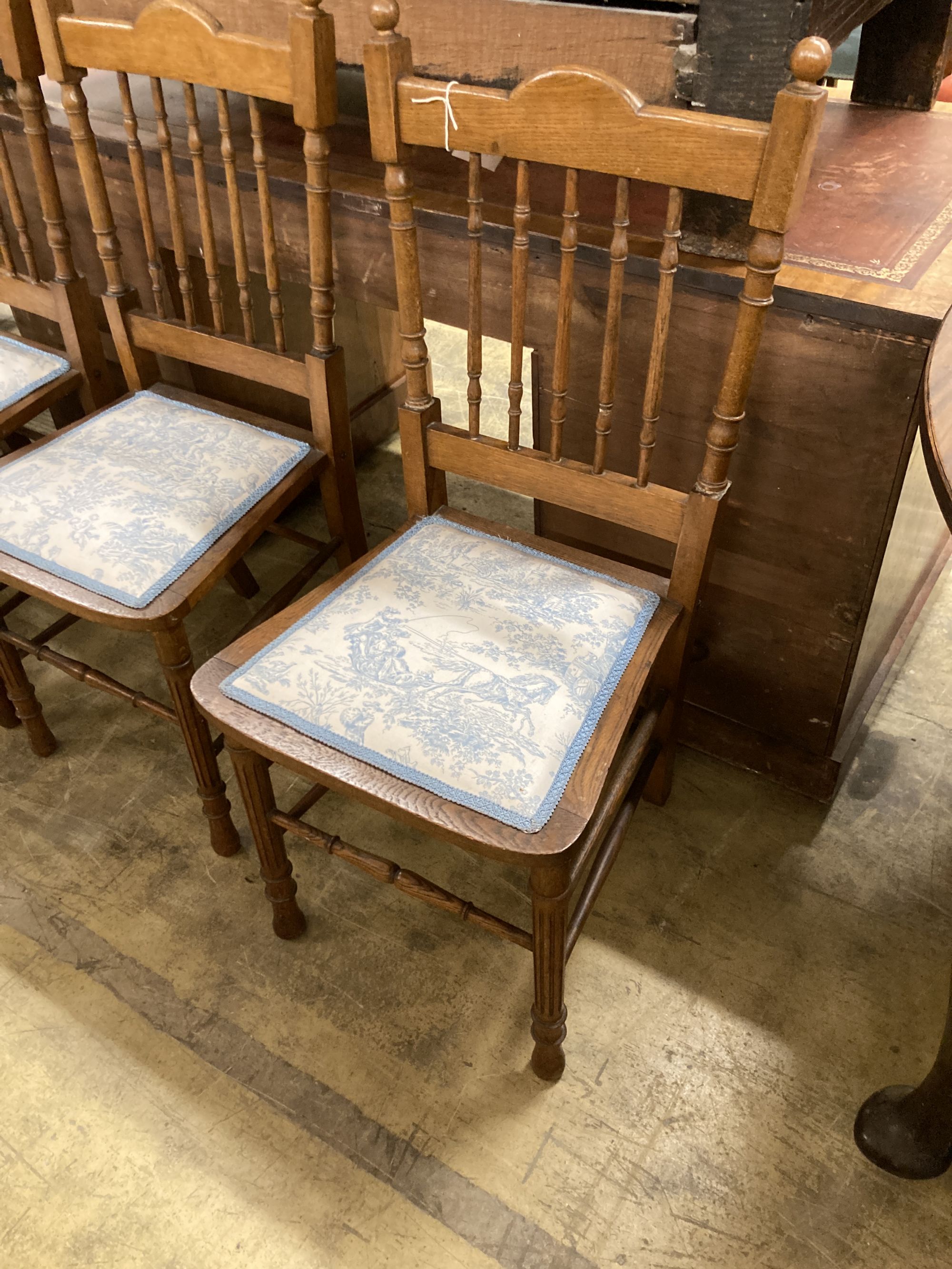 Three oak dining chairs